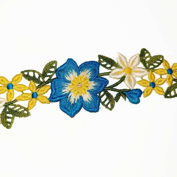 Inventory Closeout Trim in Blue, Cream, and Yellow florals with green leaves.