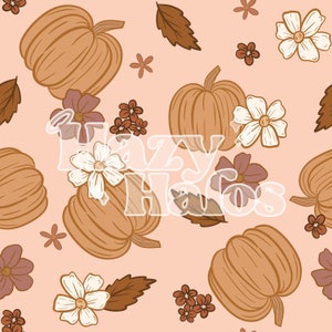 Peut inclure: Un motif sans couture représentant des citrouilles, des feuilles et des fleurs dans des tons de brun, orange, blanc et rose sur un fond pêche clair. Le texte "Lazy Hallows" est superposé au motif.