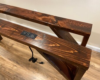 narrow console table behind couch