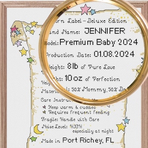 May include: A whimsical, illustrated scroll with a gold magnifying glass over it. The scroll is decorated with stars and a crescent moon. The text on the scroll reads "Born Label - Deluxe Edition, and Name: JENNIFER, Model: Premium Baby 2024, Production Date: 01.08.2024, Weight: 8lb of Pure Love, Height: 10oz of Perfection, Material: 50% Mommy, 50% Daddy, Care Instructions: Keep warm & cuddly, Requires frequent feeding, Fragile: Handle with Care, Noise Level: HIGH especially at night, Made in Port Richey, FL, Warning!!! Causes extreme sleep deprivation but also unlimited love."