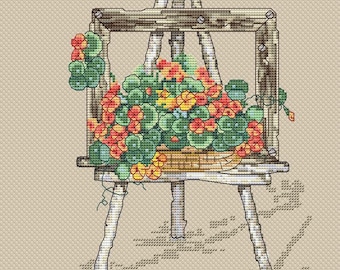 May include: A wooden easel with a rustic frame holds a vibrant arrangement of orange and yellow flowers. The flowers are nestled in a woven basket and spill over the sides of the frame.
