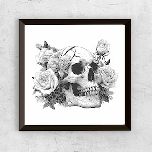 May include: Black and white framed art print featuring a detailed illustration of a human skull adorned with roses. The skull has cracks and is surrounded by detailed floral elements, creating a gothic aesthetic.