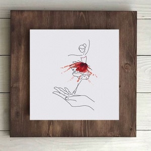 Puede incluir: Un dibujo de línea de una bailarina con un tutú rojo con salpicaduras de acuarela roja a su alrededor. La bailarina está siendo sostenida por una mano.