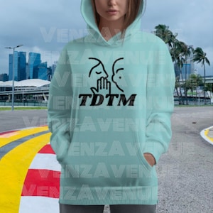 May include: A light blue hoodie with a black graphic of two people with their hands clasped together and the text "TDTM" underneath.