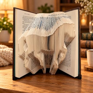 May include: A book with pages folded to create a three-dimensional sculpture of a horse. The book is open, displaying the intricate paper folding technique where the edges of the pages form the silhouette of the animal against the printed text.