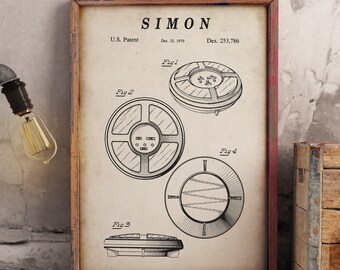 May include: A vintage patent drawing for the Simon electronic game. The drawing shows four different views of the game, labeled Fig. 1, Fig. 2, Fig. 3, and Fig. 4. The patent was filed on December 25, 1979, and was assigned the design patent number 253,786.