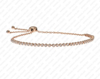 May include: A rose gold bracelet with a delicate chain and a row of small round diamonds. The bracelet has an adjustable sliding clasp.