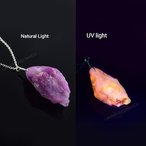 May include: A raw, purple gemstone pendant on a silver chain, shown under natural light. The image also shows the same pendant under UV light, revealing an orange glow. The text "Natural Light" and "UV light" are displayed.
