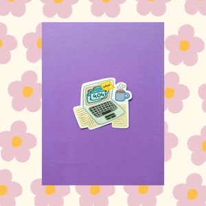 May include: A sticker depicting a laptop displaying a 404 error message, a sticky note saying "What", and a mug of coffee. The sticker is set against a purple backdrop.