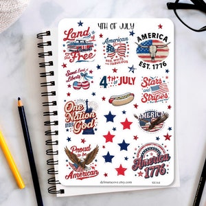May include: A sheet of stickers with patriotic designs for the 4th of July. The stickers feature images of the American flag, an eagle, a hot dog, and text such as "America 1776" and "Land of the Free".