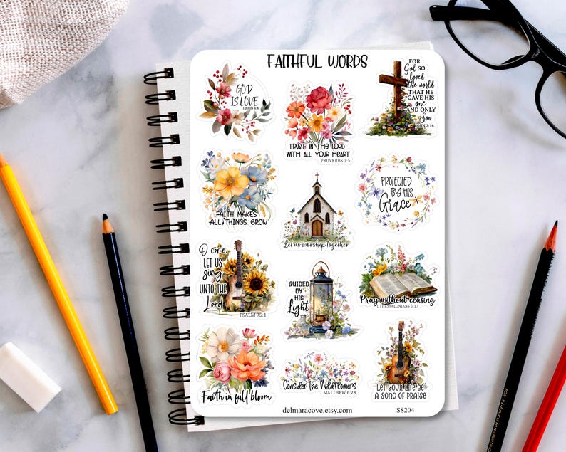May include: A sheet of stickers with floral and religious designs. The stickers feature phrases like "God is Love," "Faith Makes All Things Grow," and "Protected by His Grace." A guitar, cross, and open book are also depicted.