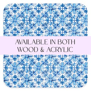 May include: Blue and white tile pattern with a repeating floral design. The text "AVAILABLE IN BOTH WOOD & ACRYLIC" is displayed on a purple banner.