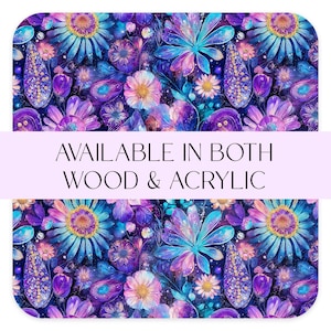 May include: A vibrant floral pattern in shades of blue, purple, and pink. The design features stylized flowers and foliage with a watercolor effect. Text reads "AVAILABLE IN BOTH WOOD & ACRYLIC".