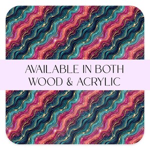 May include: Abstract design with wavy patterns in teal, pink, and burgundy, accented with gold lines and glitter. The text "AVAILABLE IN BOTH WOOD & ACRYLIC" is displayed across the image. The design is repeated.