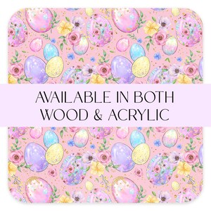 May include: A seamless pattern featuring pastel pink Easter eggs with glitter and floral accents on a pink background. The text "AVAILABLE IN BOTH WOOD & ACRYLIC" is displayed on a purple banner.