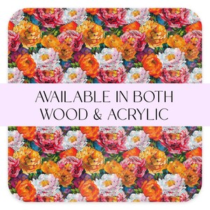 May include: A colorful floral pattern with red, orange, yellow, white, and pink flowers. The text "AVAILABLE IN BOTH WOOD & ACRYLIC" is displayed on a purple banner.