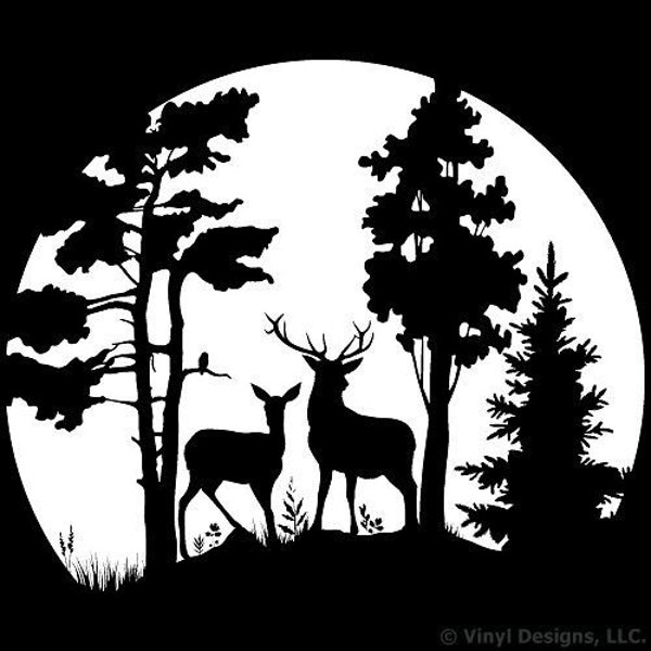 deer standing in trees