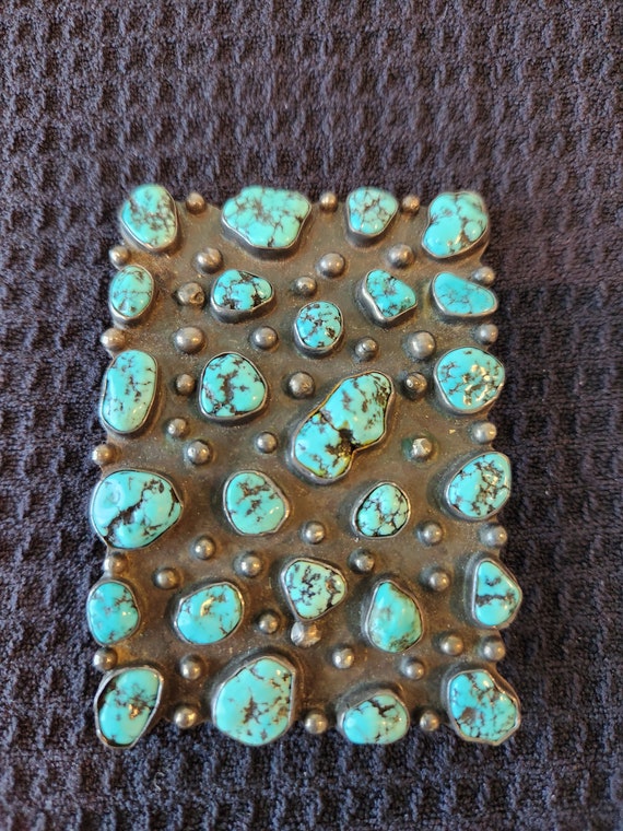 Large belt buckle with Turquoise stones.