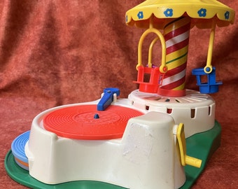 Fisher Price change a tune carousel. Vintage 1980s musical toy. 4 records which play 8 songs. Little people series. 170. Record player. Gift