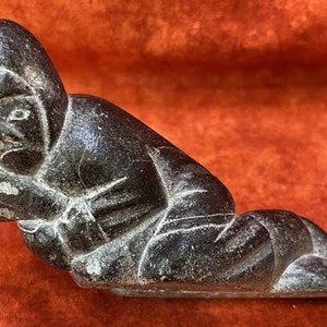 Inuit soapstone carving. Eskimo soapstone sculpture by Joshua Nappatu Qaqutu. Canadian Indigenous Inuit soapstone art. E9-1371. Hand carved