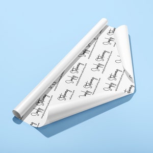 May include: A roll of white wrapping paper with a repeating pattern of the text "Simply Stationery" and the website address "simplystationery.etsy.com".