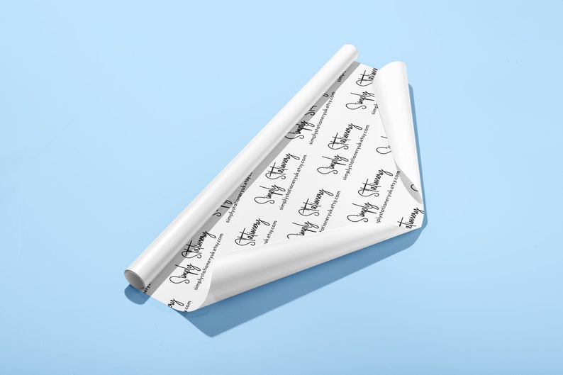May include: A roll of white wrapping paper with a repeating pattern of the text "Simply Stationery" and the website address "simplystationery.etsy.com".