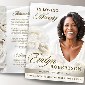 May include: A memorial card with a photo of a smiling woman, Evelyn Robertson, and the text "In Loving Memory." The card features white roses and details of her birth and passing.