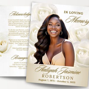 以下が含まれることがあります： 白いバラに囲まれた、笑顔の女性の写真が載った追悼カード。「In Loving Memory」の文字と、Aaliyah Jasmine Robertsonの名前、1975年8月7日～2025年10月5日の日付が記載されています。