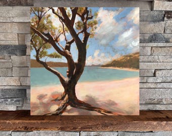 May include: A painting of a tree on a beach with blue water and a cloudy sky. The tree has a thick trunk and branches that reach out towards the water. The sand is white and the water is a light blue.
