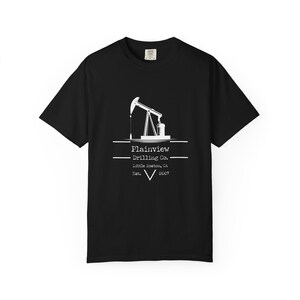 May include: Black t-shirt with a white graphic of an oil pump jack and the text "Plainview Drilling Co. Little Boston, CA Est. 2007". The shirt has short sleeves and a crew neck.