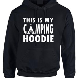 May include: Black hooded sweatshirt with the text "THIS IS MY CAMPING HOODIE" in white block letters. The word "CAMPING" features a white tent graphic. The sweatshirt has a front pocket and a drawstring hood.