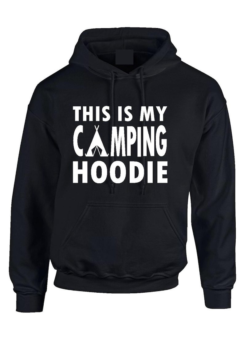 May include: Black hooded sweatshirt with the text "THIS IS MY CAMPING HOODIE" in white block letters. The word "CAMPING" features a white tent graphic. The sweatshirt has a front pocket and a drawstring hood.