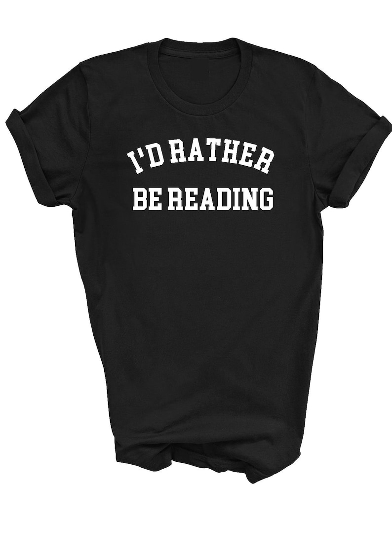 May include: Black t-shirt with white text that reads "I'd rather be reading" in a collegiate font.