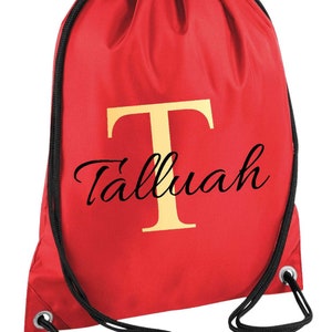 drawstring waterproof bag in red colour with a gold monogram letter and script name
