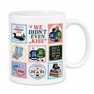 May include: A white ceramic mug featuring a grid of colorful postage stamp-style illustrations. Designs include a loon, hockey jerseys numbered 24 and 81, socks with ducks, and text reading "WE DIDN'T EVEN KISS" and "Does it feel like agony for you too?"