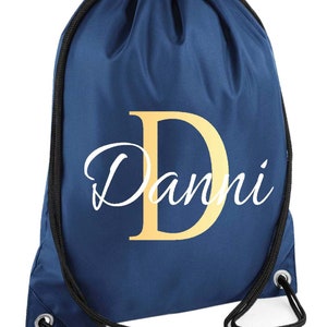drawstring waterproof bag in navy colour with a gold monogram letter and script name