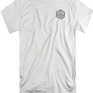 May include: A white short-sleeve t-shirt featuring a black line art graphic of a twenty-sided die on the upper left chest area. The die displays the number 20 prominently at the top, with other numbers visible on the triangular faces of the shape.