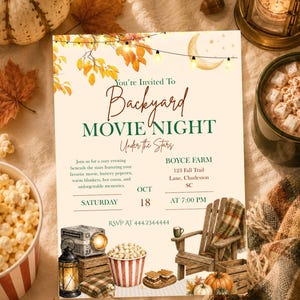 May include: A rectangular invitation card for a Backyard Movie Night at Boyce Farm on Saturday, Oct 18 at 7:00 PM. The design features autumn leaves, string lights, a crescent moon, a projector, popcorn, a wooden chair, and pumpkins.