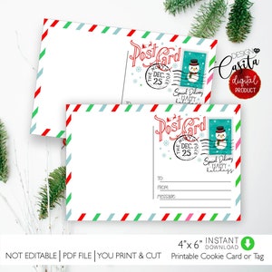 May include: Two white Christmas postcards with red, green, and blue striped borders. Each postcard features a red "Post Card" stamp with a snowman and the text "Special Delivery Happy Holidays". The postcards measure 10.16cm x 15.24cm.