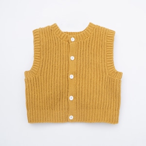 May include: Mustard yellow knitted vest with a round neckline and button-up front. The sleeveless garment features a ribbed knit texture and white buttons. A simple, classic style.