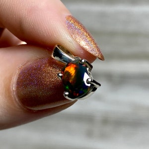 Black Opal in Sterling Silver Pendant from Curious Muse Crystals for 52. Tagged with black opal, crystal healing, Crystal Jewelry, energy work, flashy opal, hide-notify-btn, opal, opal crystal pendant, reiki crystal, Sterling, sterling silver, witchy