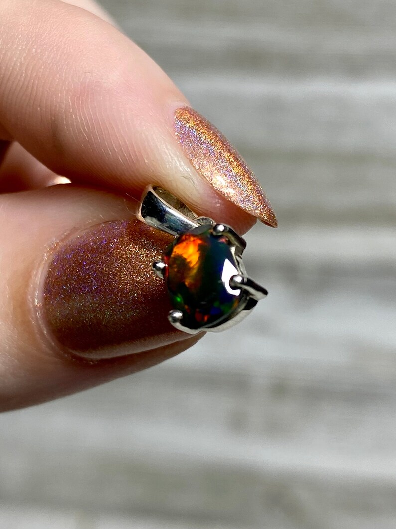 Black Opal in Sterling Silver Pendant from Curious Muse Crystals for 52. Tagged with black opal, crystal healing, Crystal Jewelry, energy work, flashy opal, hide-notify-btn, opal, opal crystal pendant, reiki crystal, Sterling, sterling silver, witchy