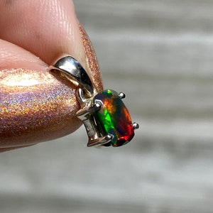 Black Opal in Sterling Silver Pendant from Curious Muse Crystals for 70. Tagged with black opal, crystal healing, Crystal Jewelry, energy work, flashy opal, hide-notify-btn, opal, opal crystal pendant, reiki crystal, Sterling, sterling silver, witchy