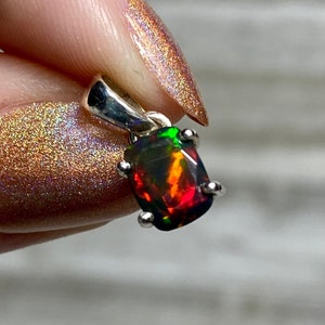 Black Opal in Sterling Silver Pendant from Curious Muse Crystals for 70. Tagged with black opal, crystal healing, Crystal Jewelry, energy work, flashy opal, hide-notify-btn, opal, opal crystal pendant, reiki crystal, Sterling, sterling silver, witchy