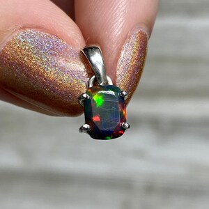 Black Opal in Sterling Silver Pendant from Curious Muse Crystals for 52. Tagged with black opal, crystal healing, Crystal Jewelry, energy work, flashy opal, hide-notify-btn, opal, opal crystal pendant, reiki crystal, Sterling, sterling silver, witchy