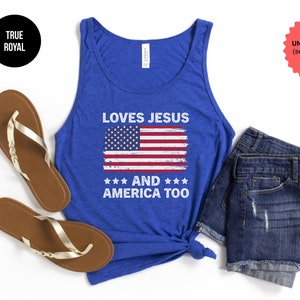 May include: A blue tank top with a distressed American flag and the text "Loves Jesus and America Too".
