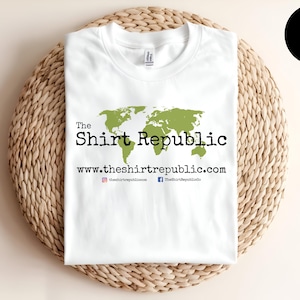 May include: White t-shirt with a green world map graphic and the text "The Shirt Republic" and "www.theshirtrepublic.com".