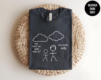 May include: A heather dark grey t-shirt featuring a white graphic of two stick figures and two clouds. The text reads: "dad, what are clouds made of?" and "linux servers, mostly". The design is printed in a simple, hand-drawn style on the front.