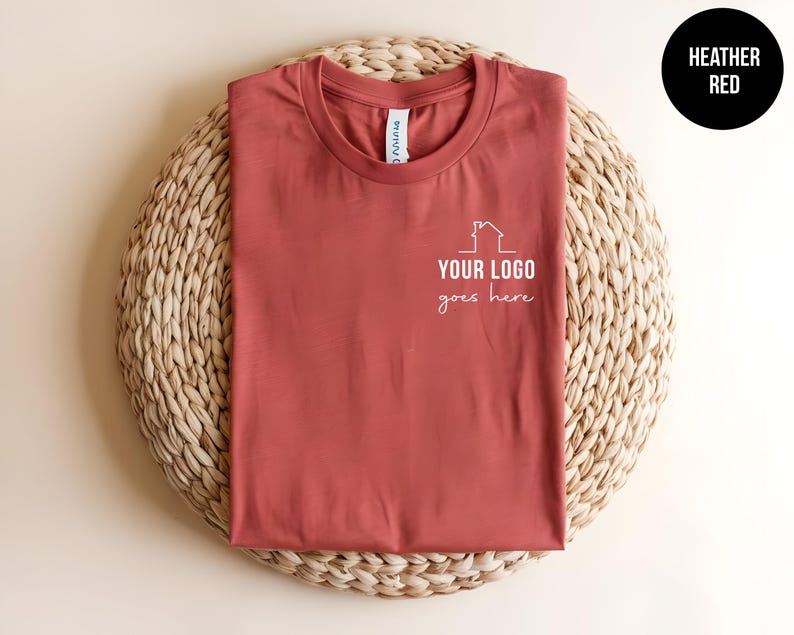 May include: Heather red t-shirt with a white house graphic and the text "YOUR LOGO goes here".