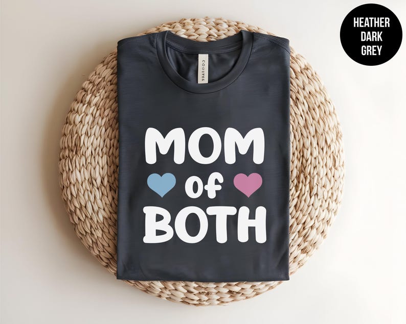 May include: Heather dark grey t-shirt with white text that reads "MOM of BOTH" with a blue heart and a pink heart.